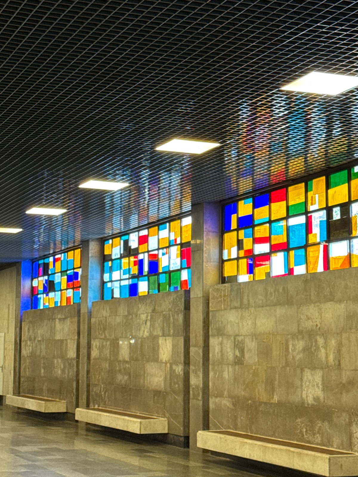 Inside New Athos: station platforms, ornate interiors, resting dog