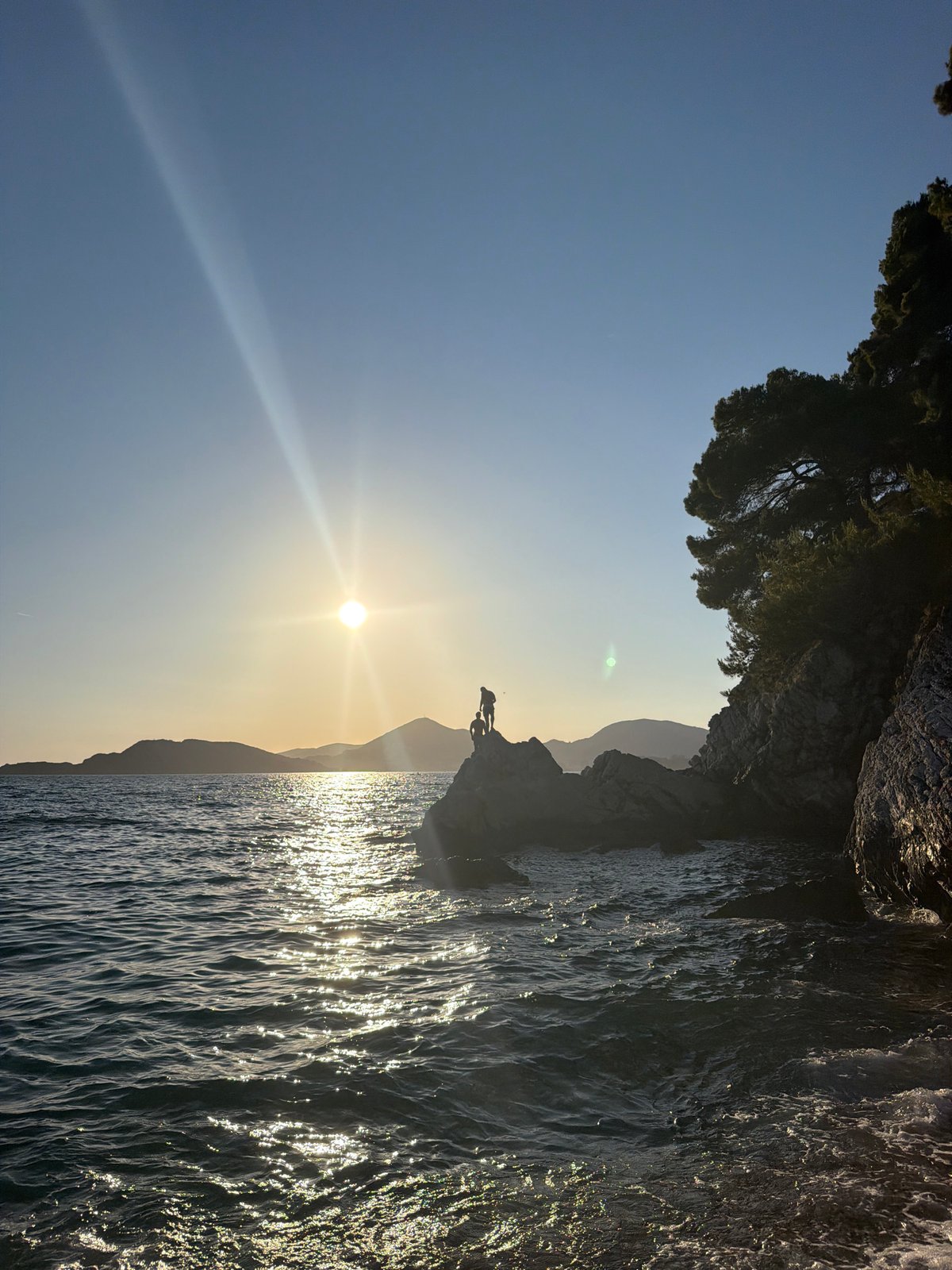 Golden hour beach photoshoot captured at Montenegro's Sveti Stefan