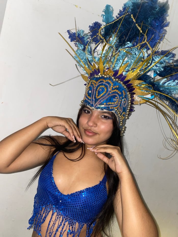 Woman poses in elaborate carnival costume in Juan Griego