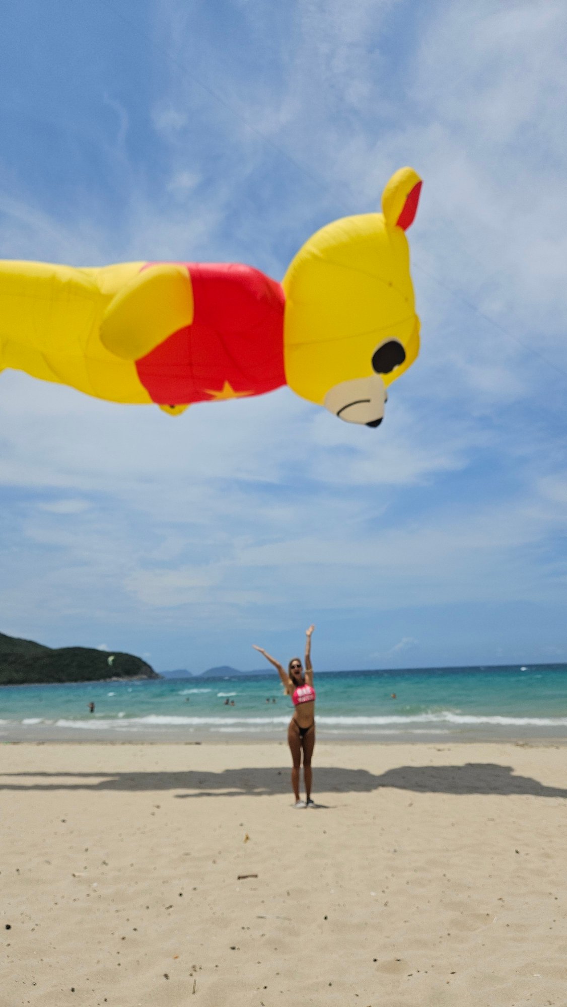 Giant Winnie the Pooh kite flies over Vietnam beach