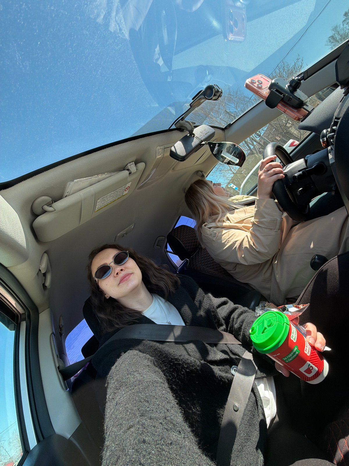 Car interior photographed in Chaikovsky showing two passengers