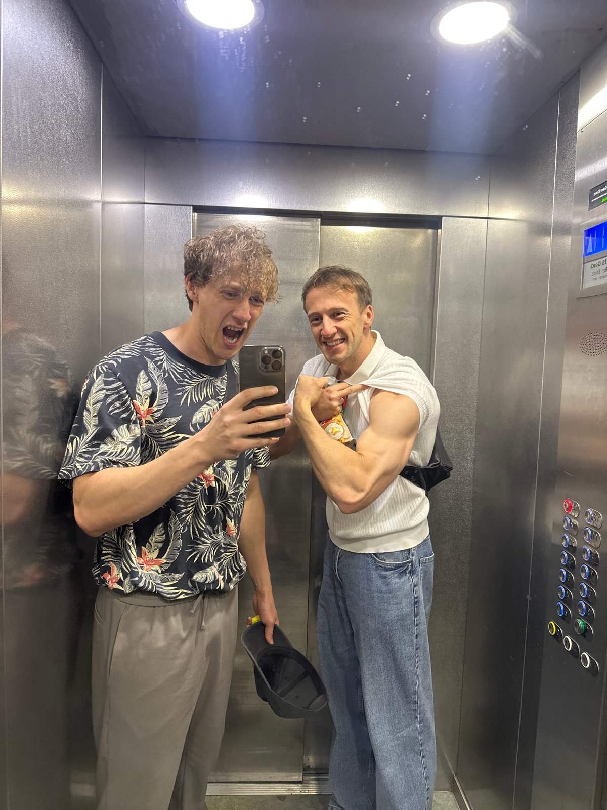 Elevator selfies in Russia, floral shirt and stainless steel walls