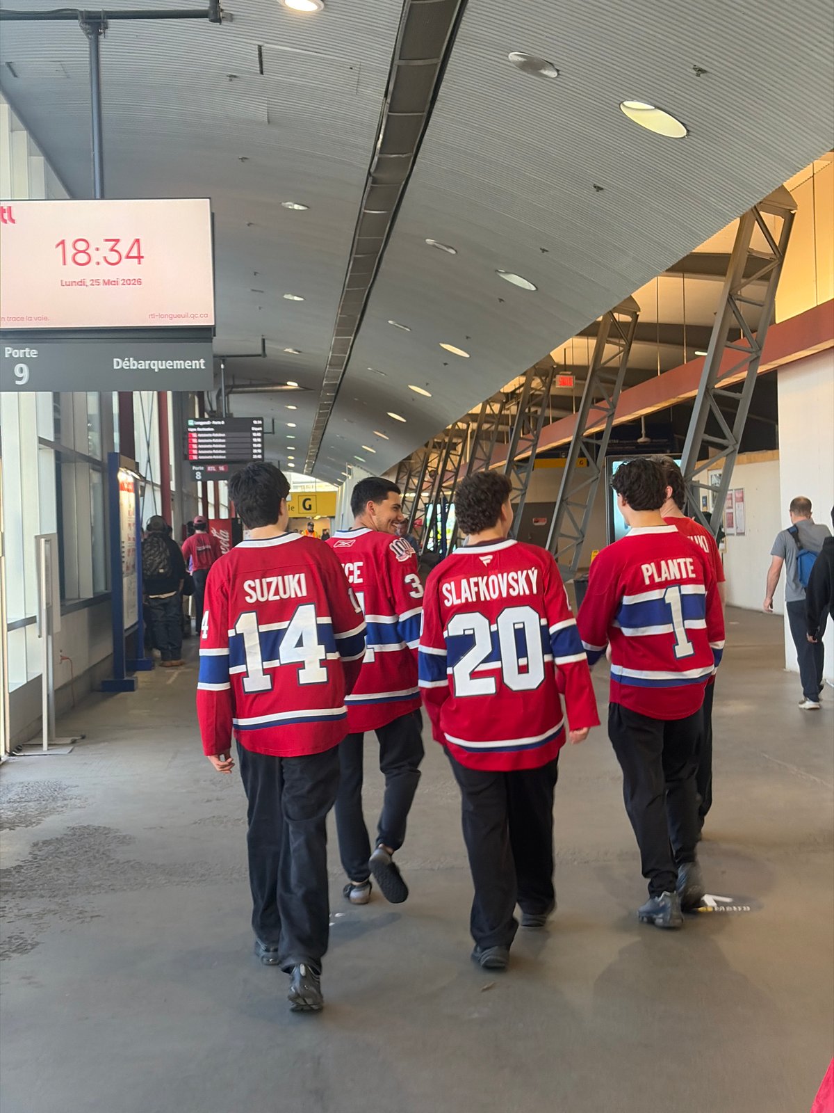 Canadiens fans in matching Suzuki jerseys spotted at Longueuil Metro