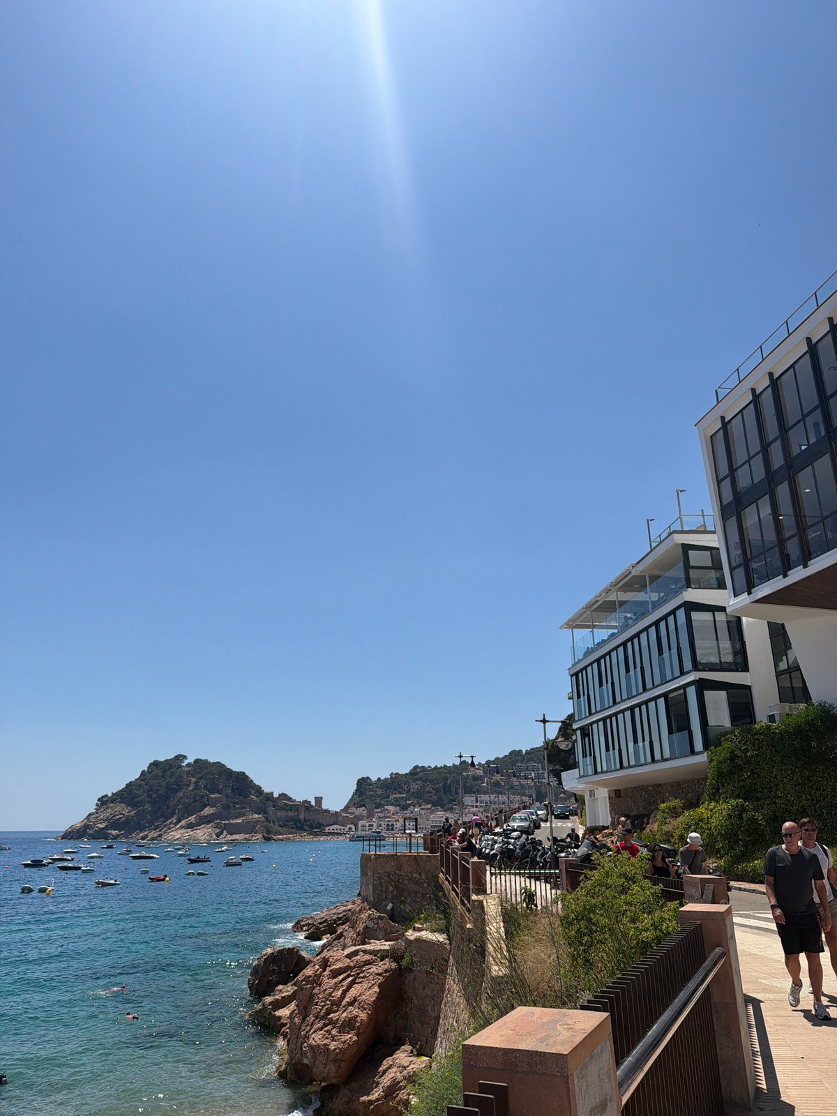 Selfies and sea views at a boat-filled coastal bay