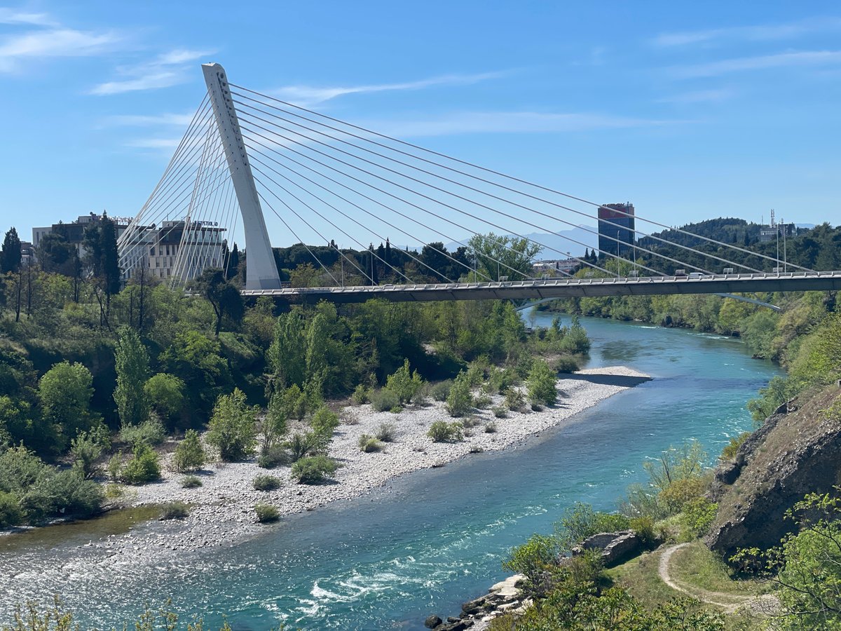 Cable-stayed bridge observed over turquoise river in Podgorica