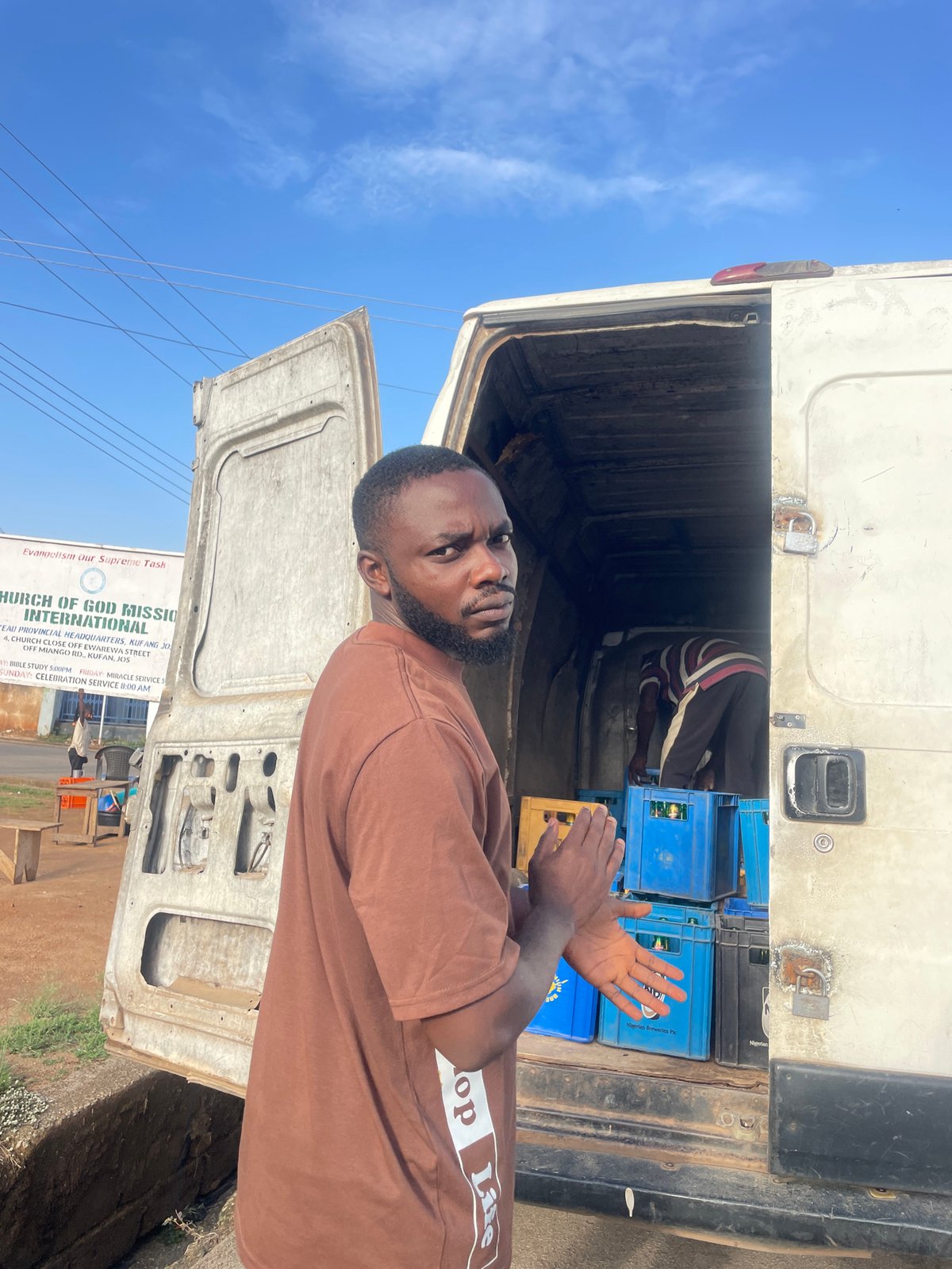 Beer delivery unloaded from truck in Jos, Nigeria