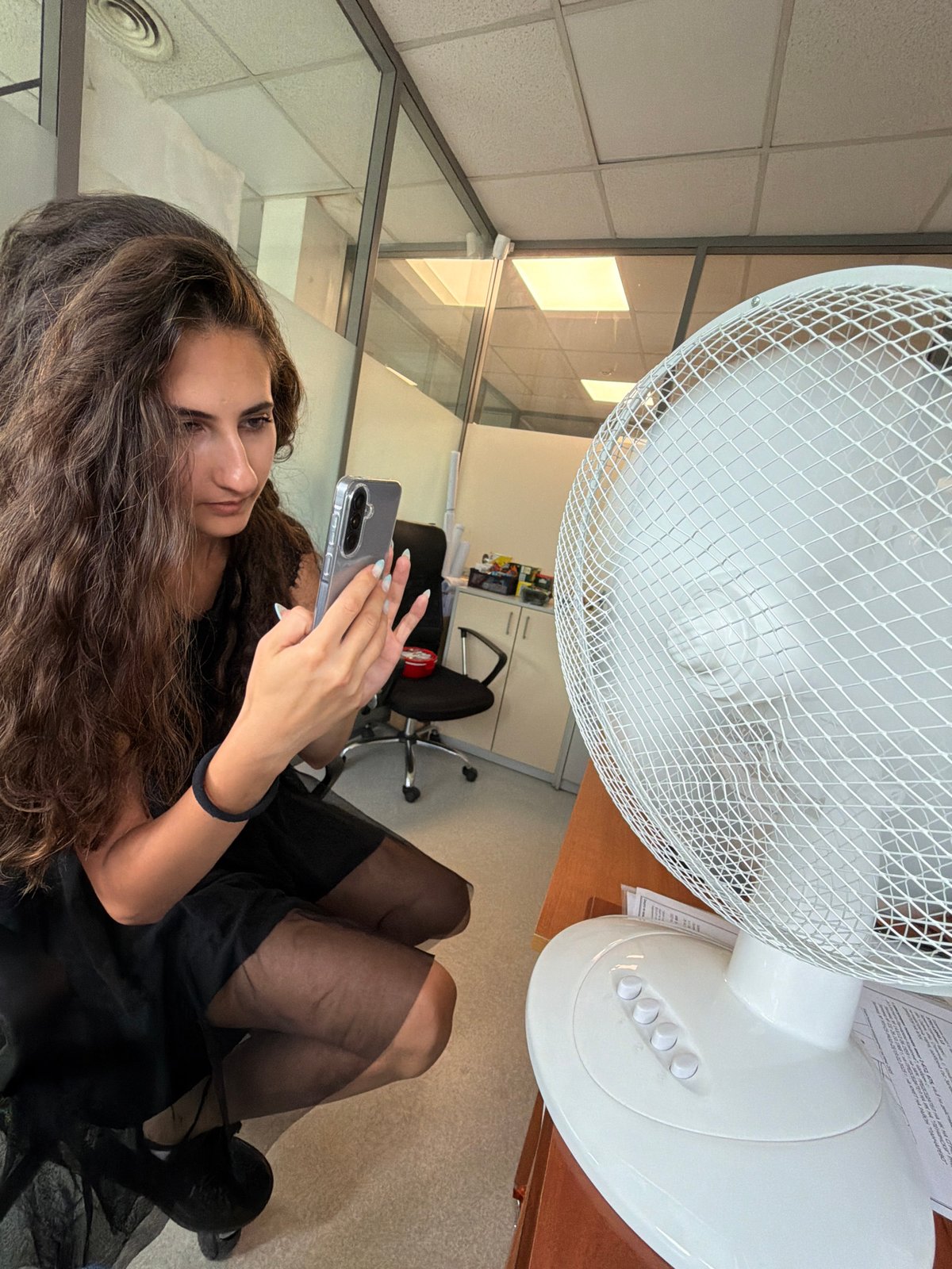 Selfies and laughs in a Sofia office with a city view