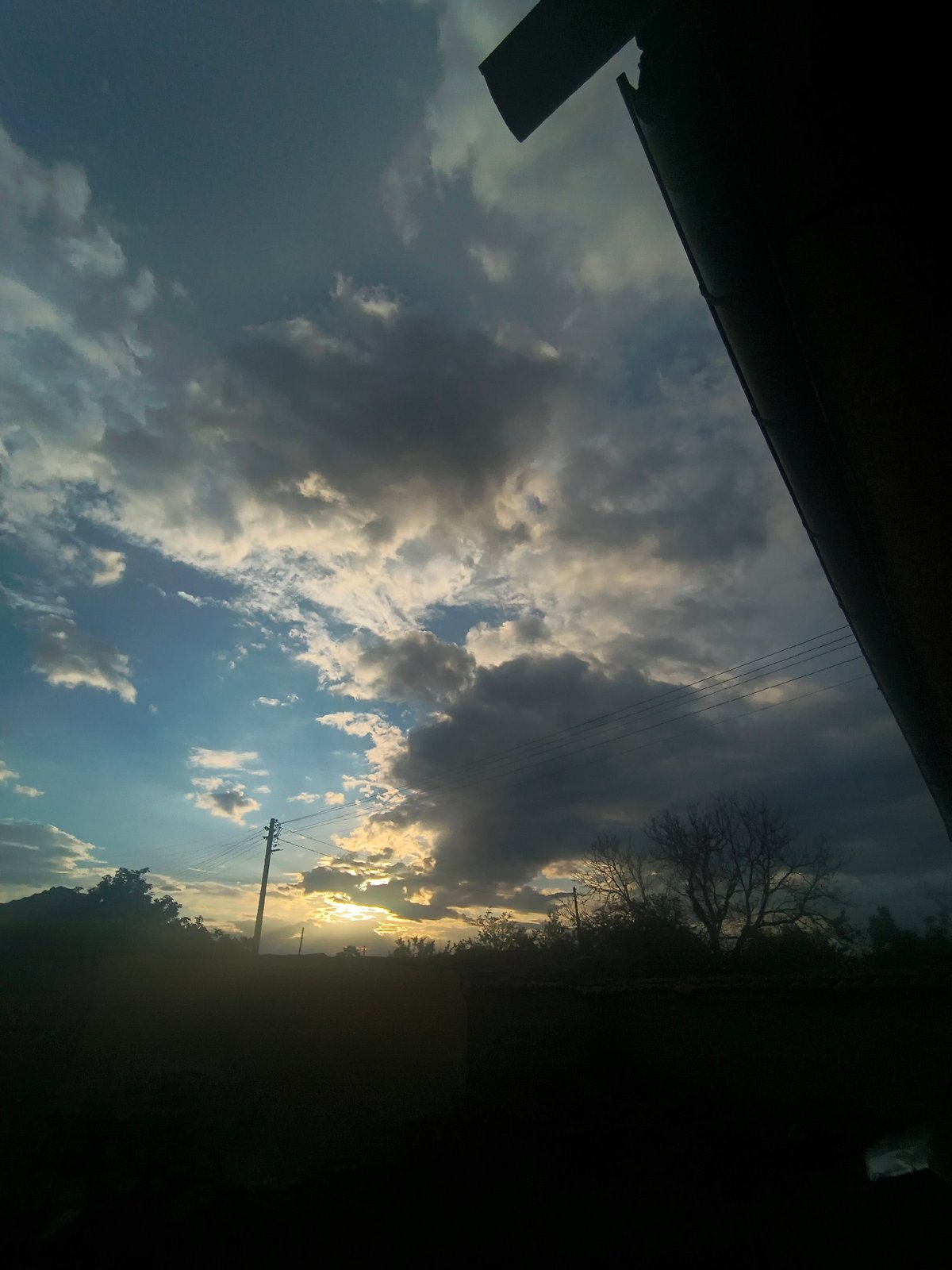 Cloudy sunset scene documented in Bulgarian village