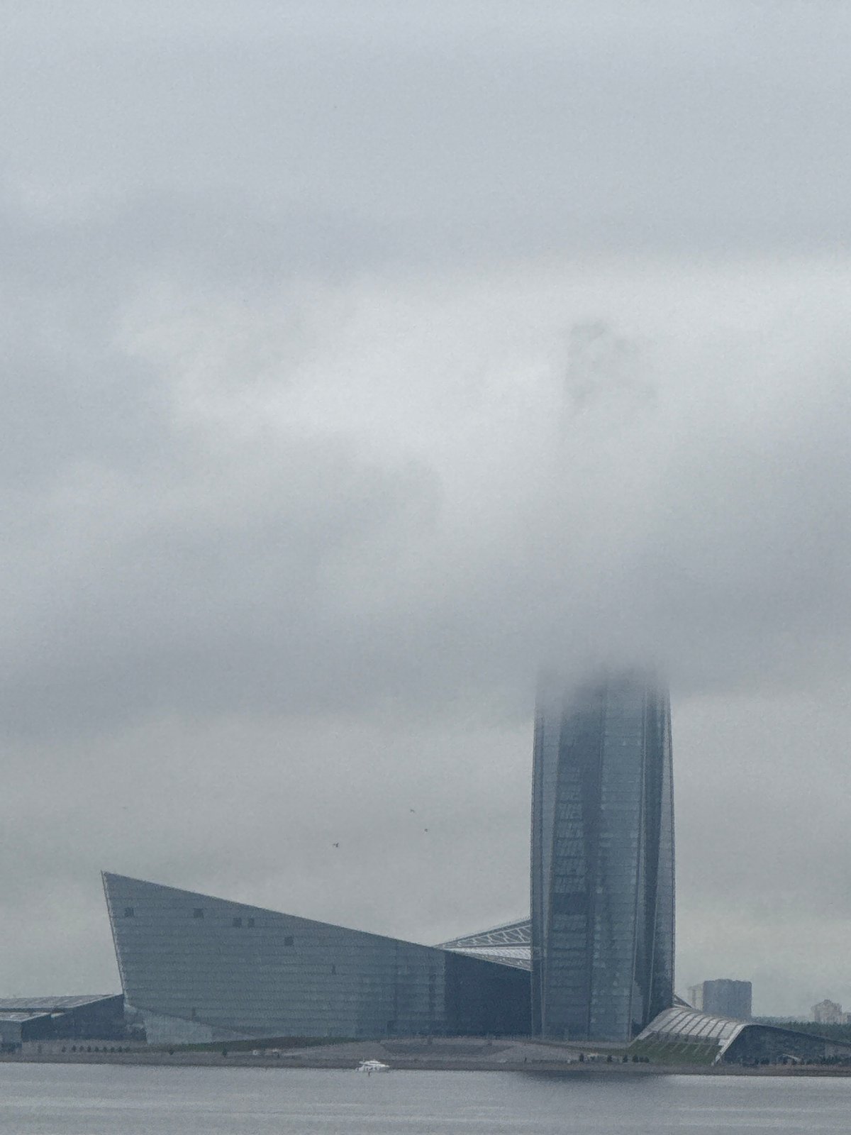 Saint Petersburg skyscrapers dissolve into heavy summer fog