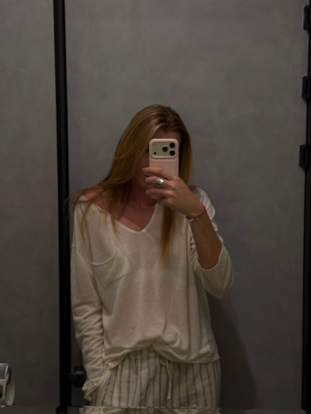 Woman takes mirror selfies at Bishkek restaurant