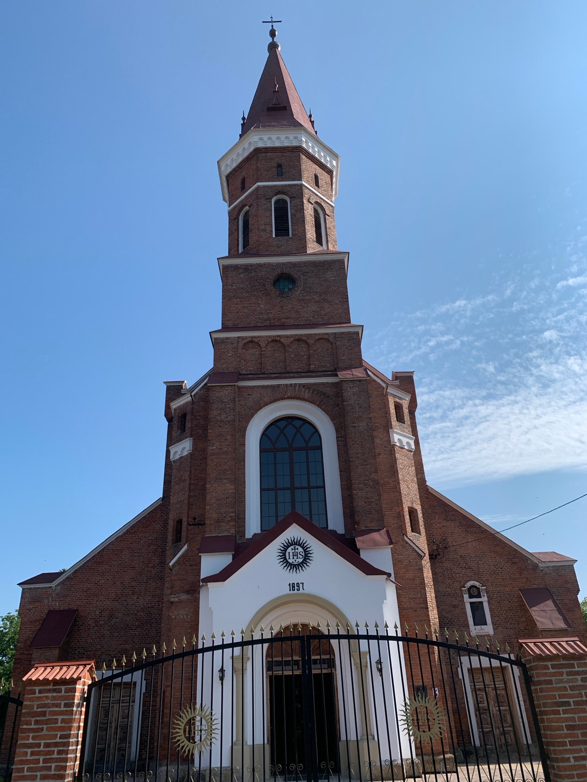 Two historic Catholic churches and summer blooms in Kolomyia