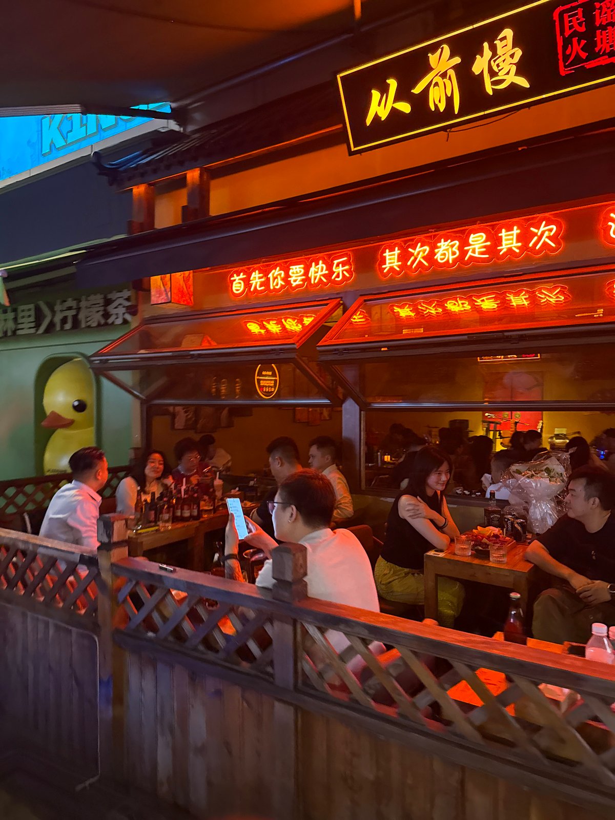 Evening street life documented across two Chinese cities