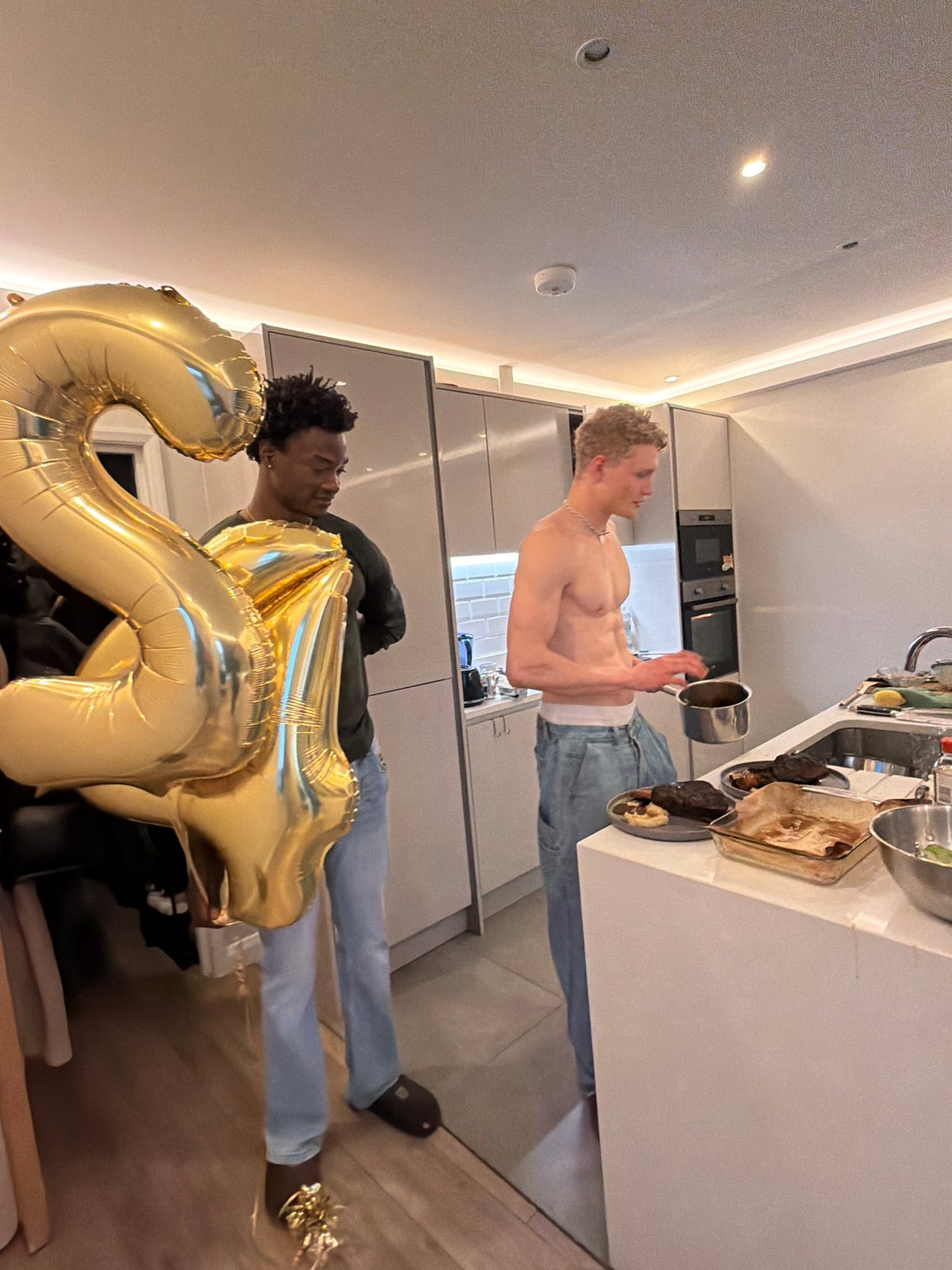 Men celebrate 25th birthday in London kitchen