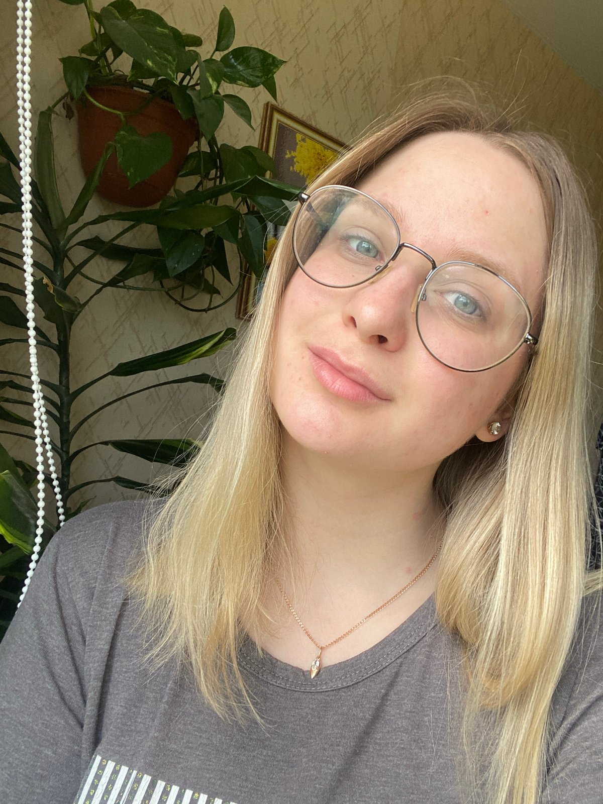 Woman Documents Morning Plant Care Session with Selfies