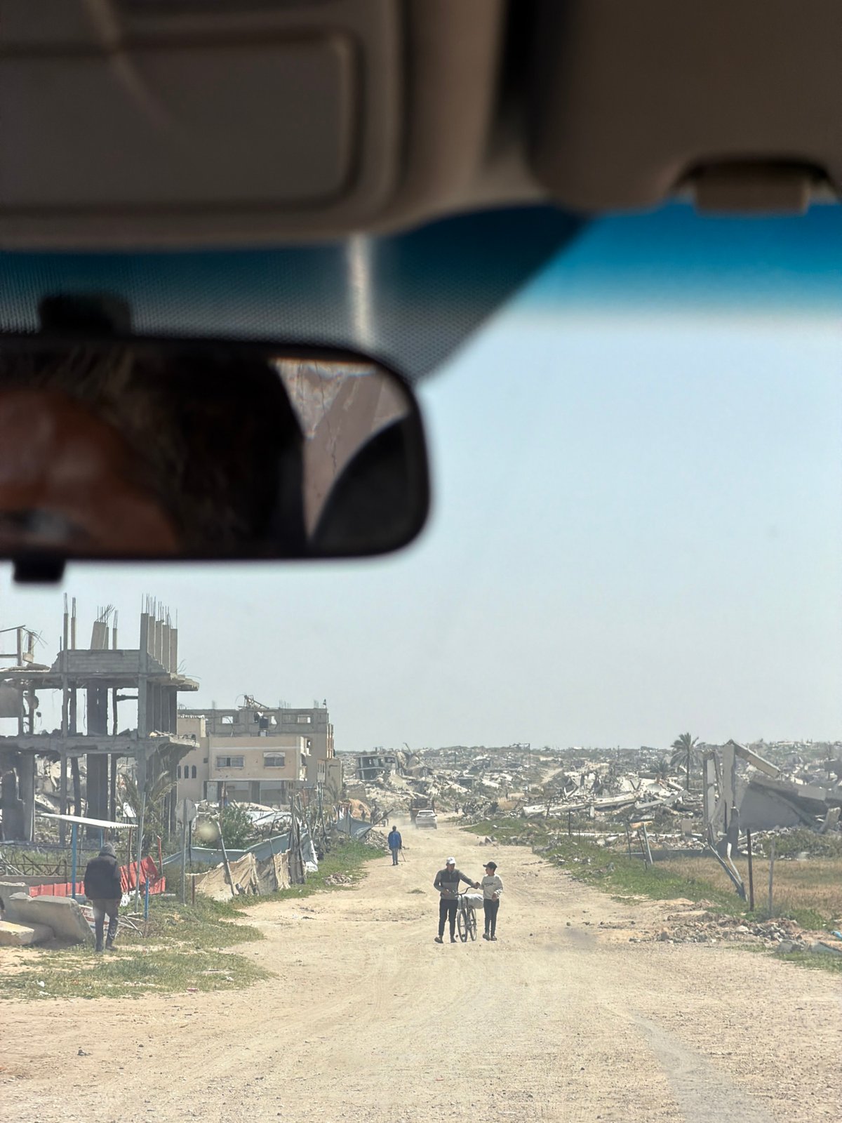 Vehicle interior view captured on Khan Yunis road