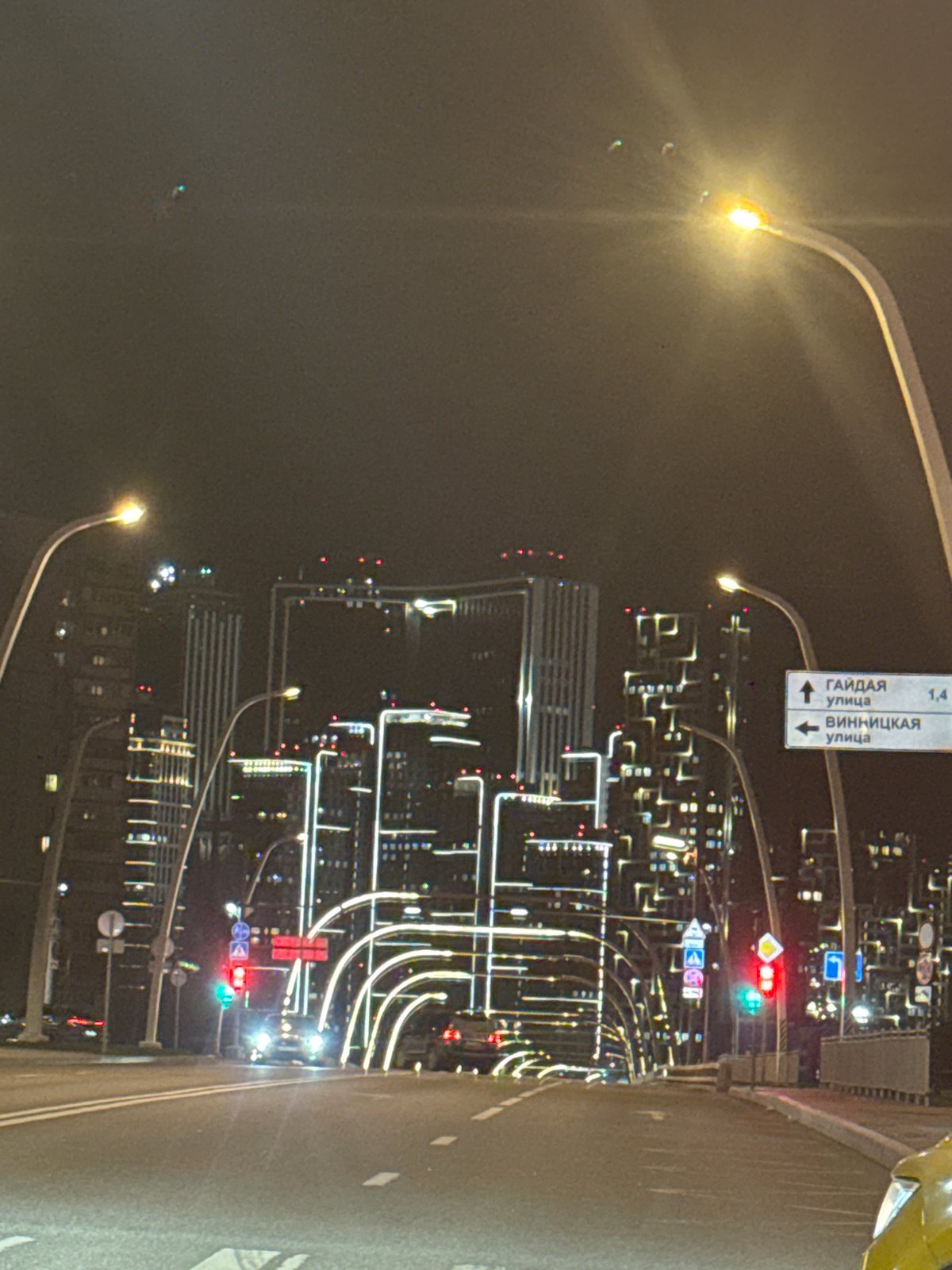 Moscow nighttime cityscape documented from moving vehicle