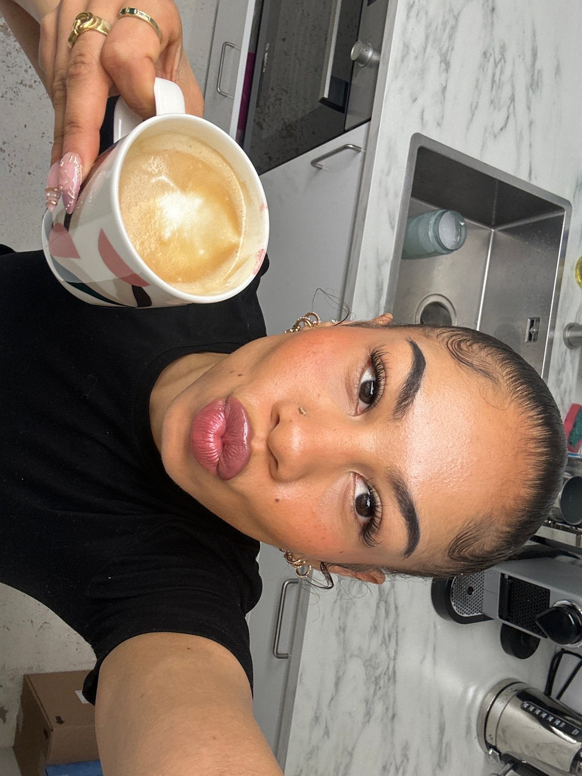 Woman documents London morning with kitchen selfie, street photography