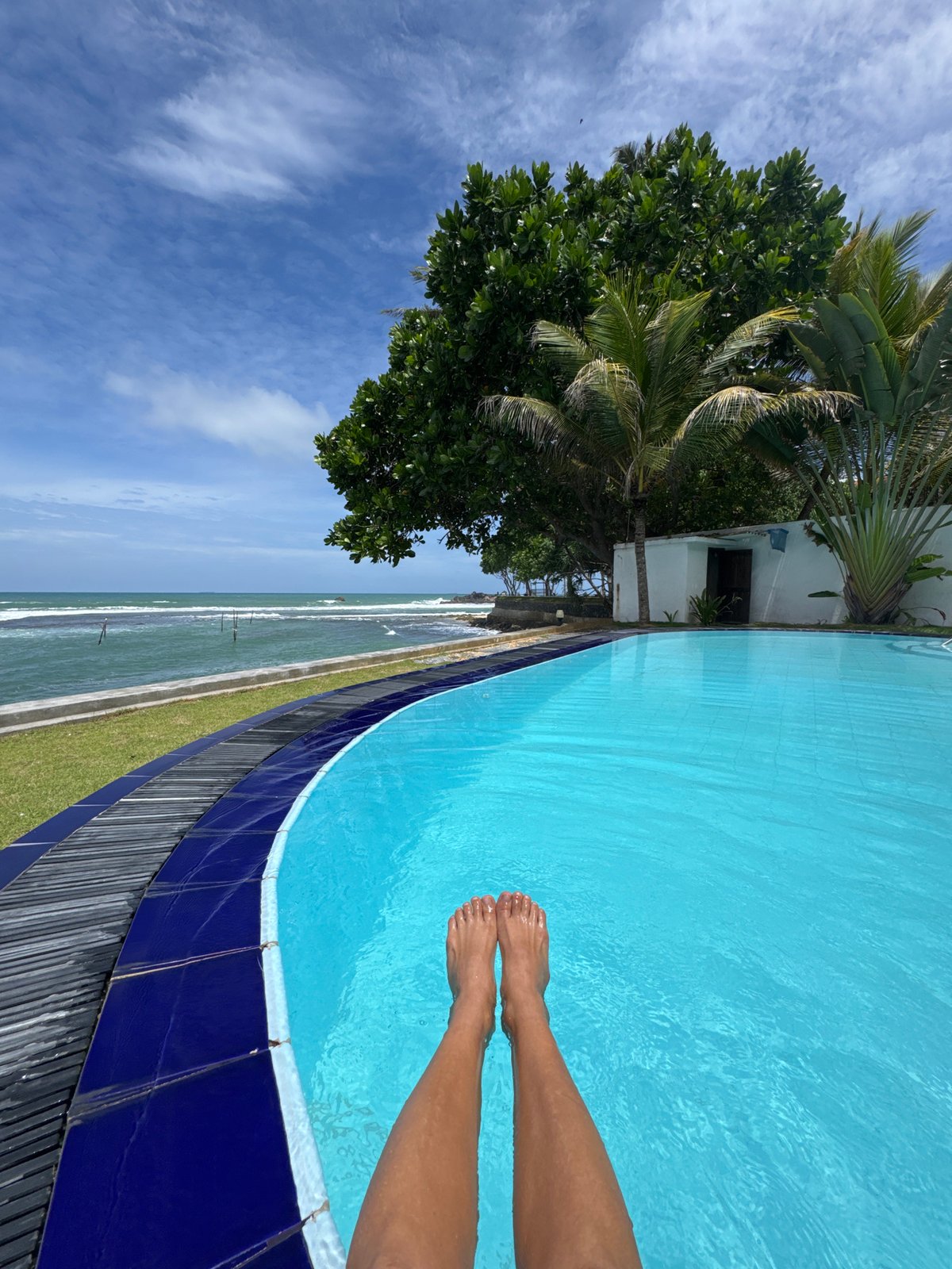 Lazy resort morning by the pool and ocean, Goviyapana