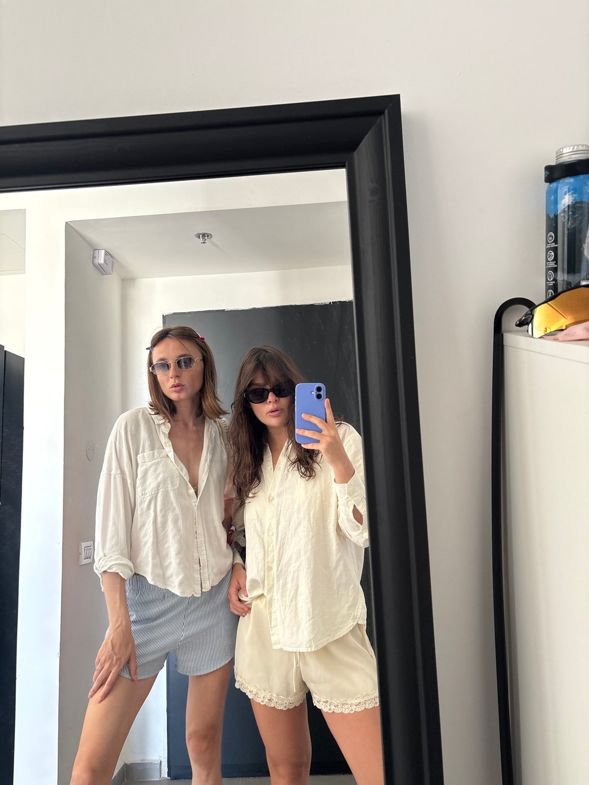 Women take mirror selfies in Tel-Aviv apartment