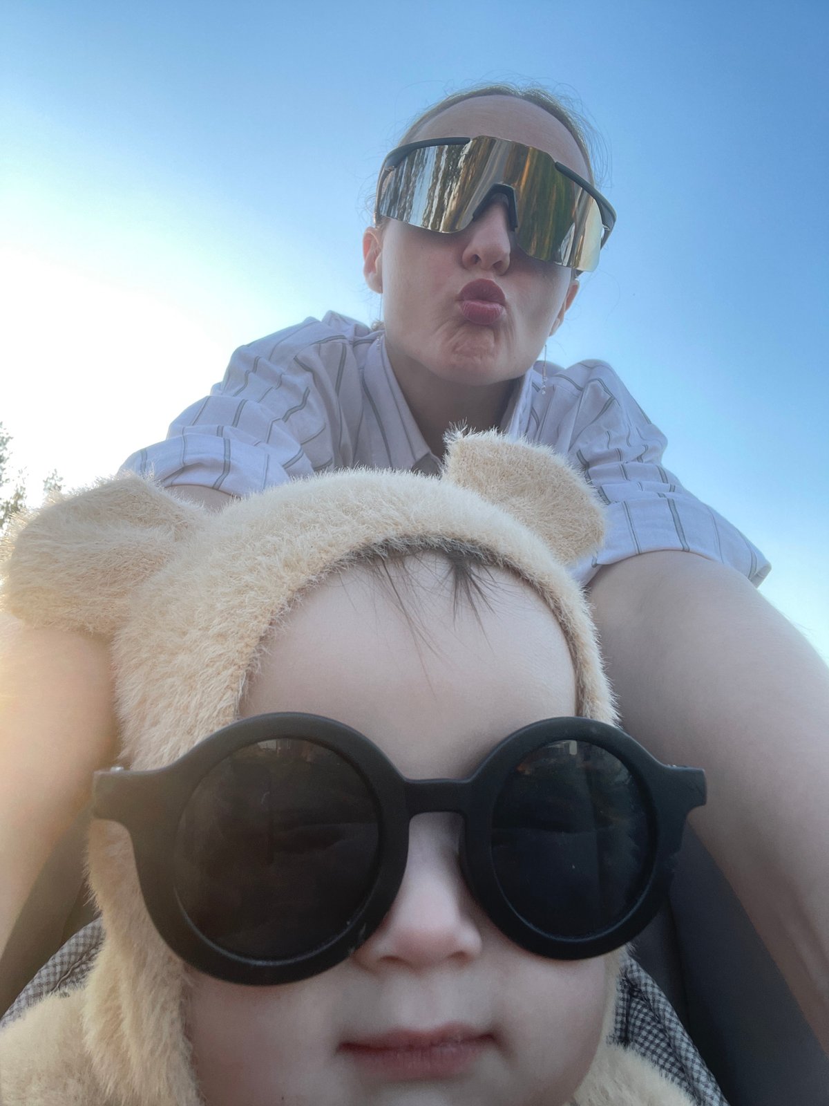 Two people photographed outdoors in sunny Russian village