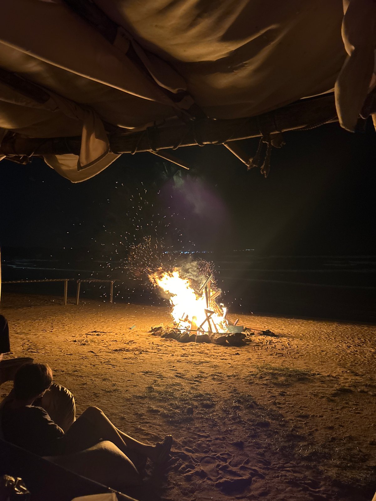 Beachside bonfire burns bright on a Sri Lankan shore