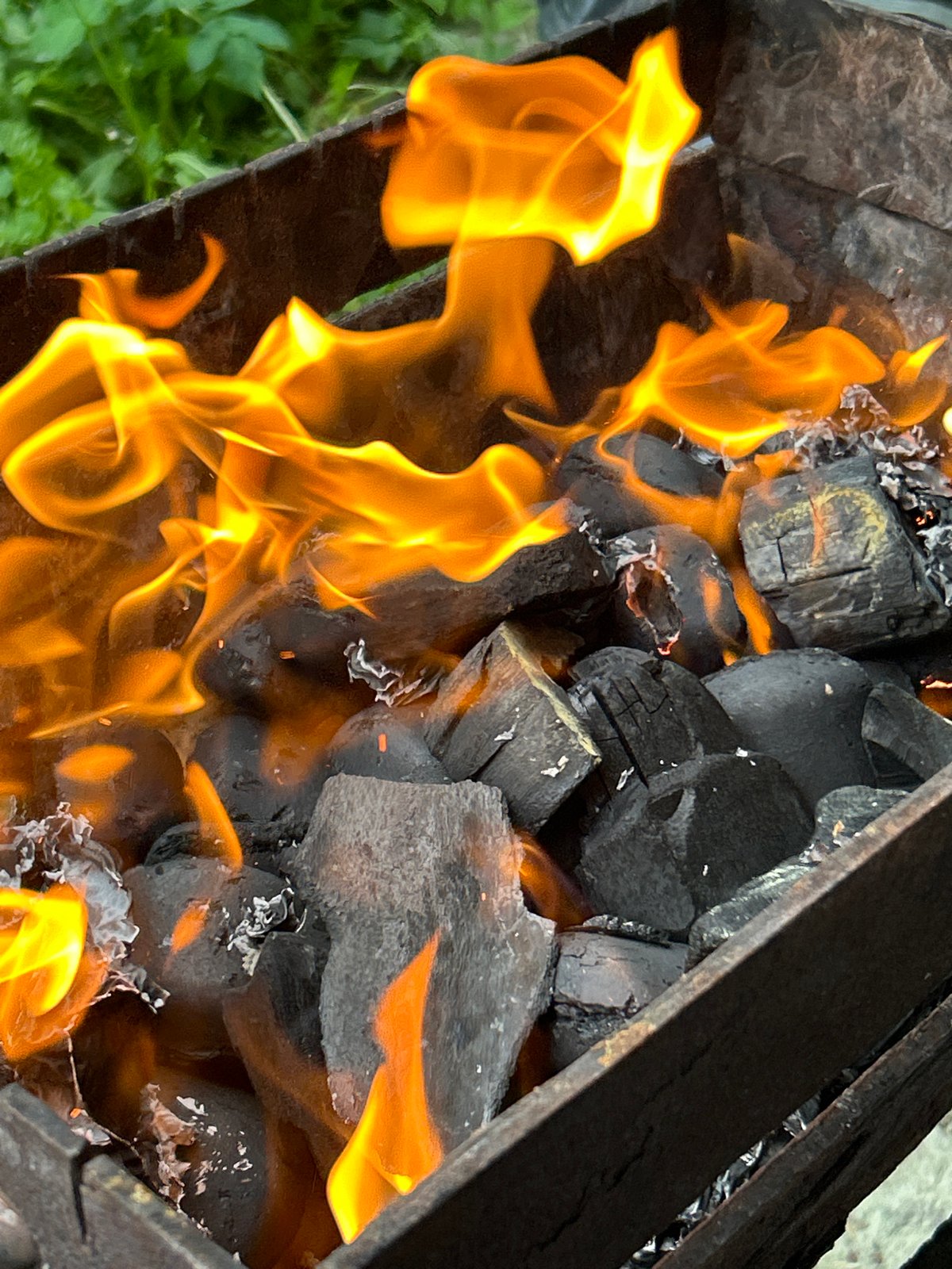Afternoon barbecue session documented in Tallinn with burning charcoal