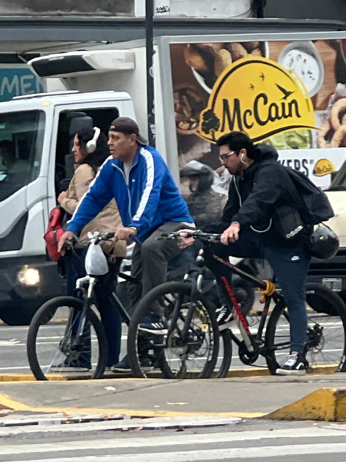 Pedestrians and cyclists share Buenos Aires street intersection