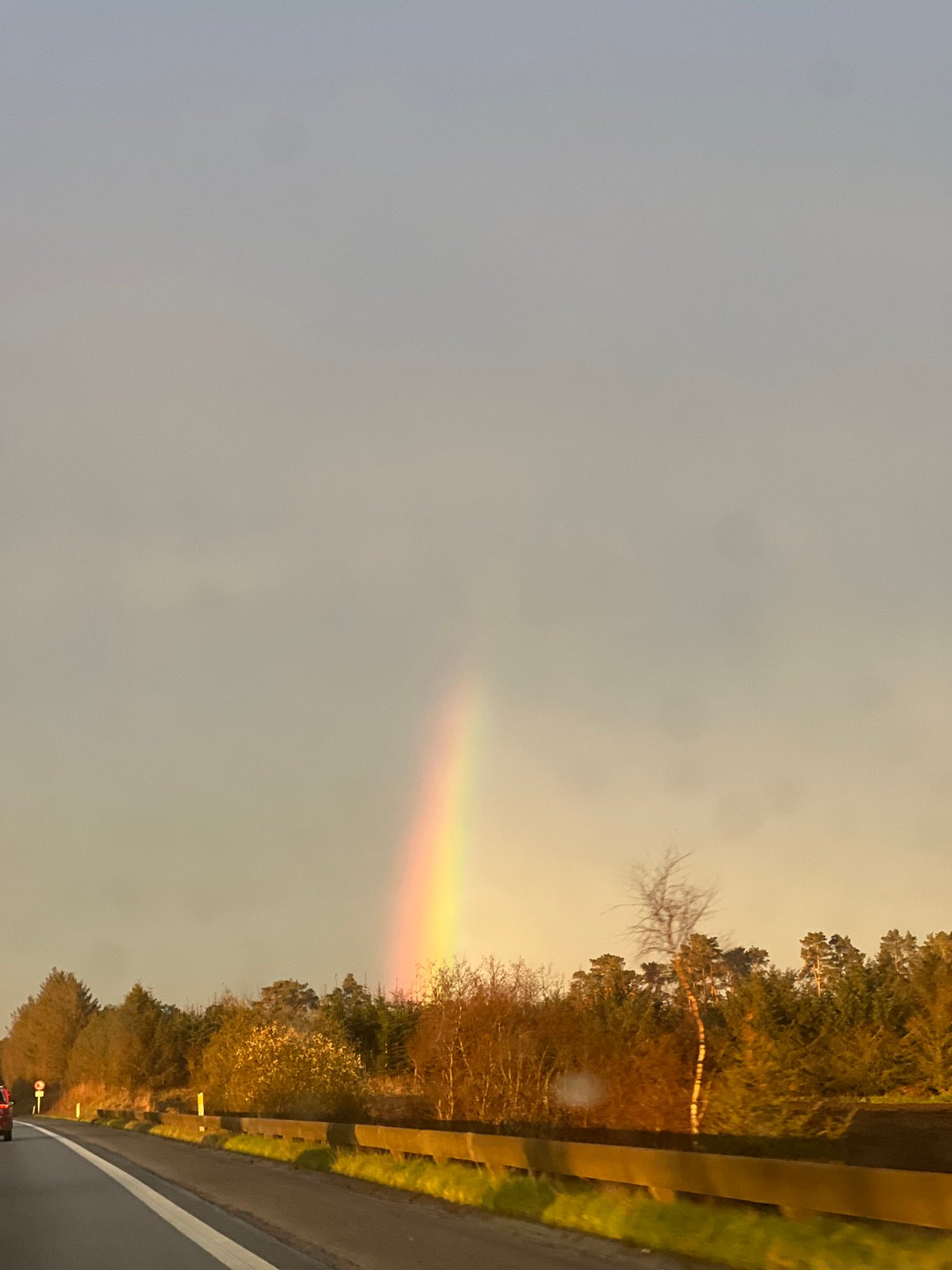 Partial rainbow spotted over highway in Ellidshøj, Denmark