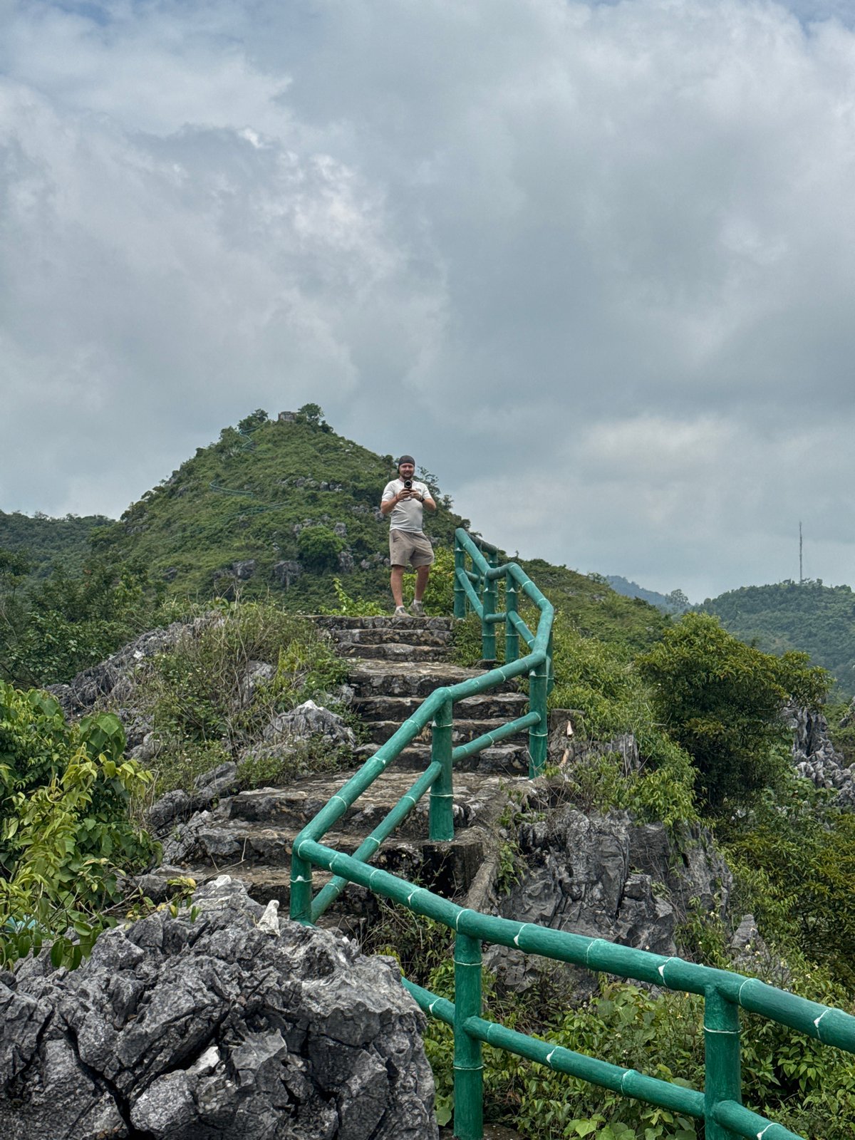 Hiking a hillside ruin above Tam Thanh Ward's rooftops