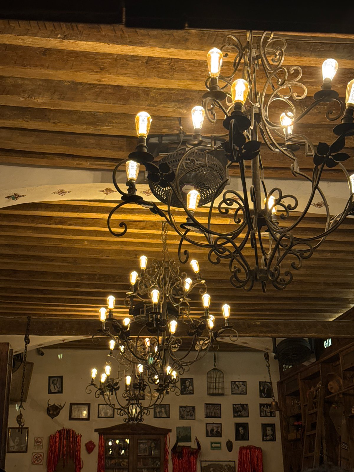 Interior scenes documented at Puebla bar featuring chandeliers, mirrors