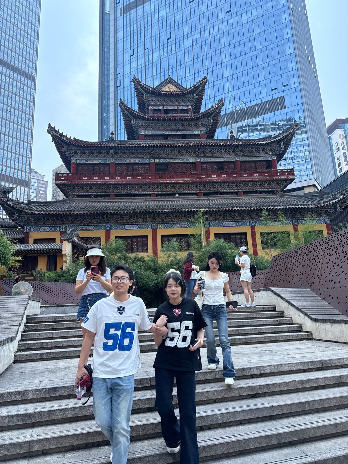 Young people gather on stone steps in Yuzhong District