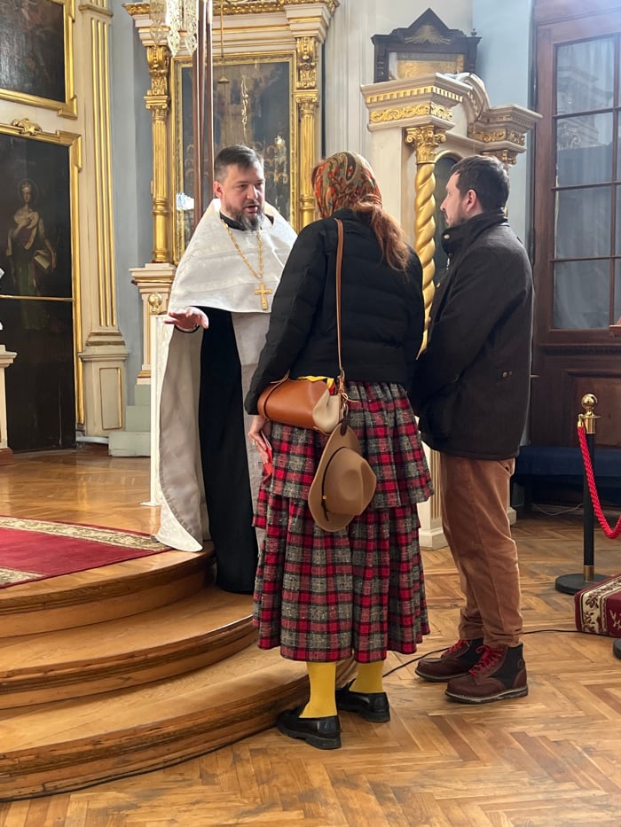Saint Petersburg residents visit Orthodox church, walk dogs in park