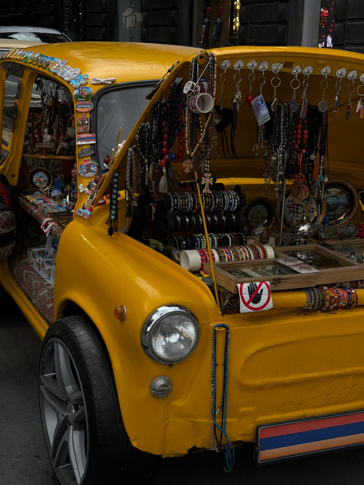 Yellow vintage vehicle operates as mobile stall