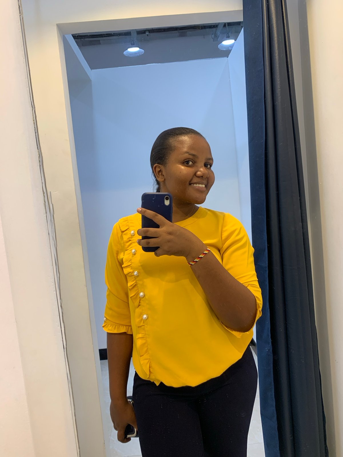 Woman takes selfies at Zara store in Dar es-Salaam