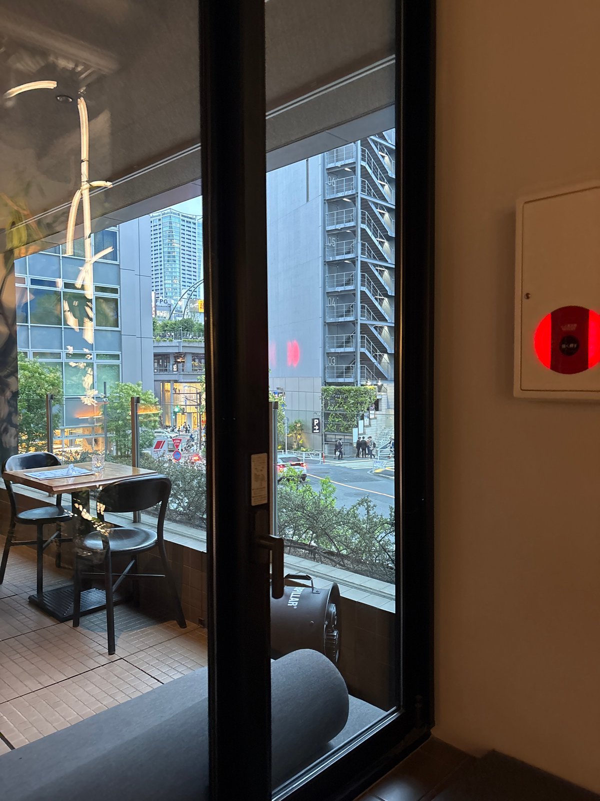 Inside a Shibuya café or shop, mid-morning routine