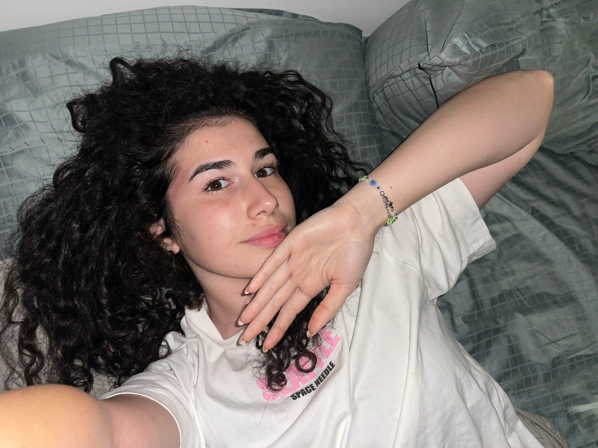 Woman and dog share quiet afternoon together in Sofia bedroom