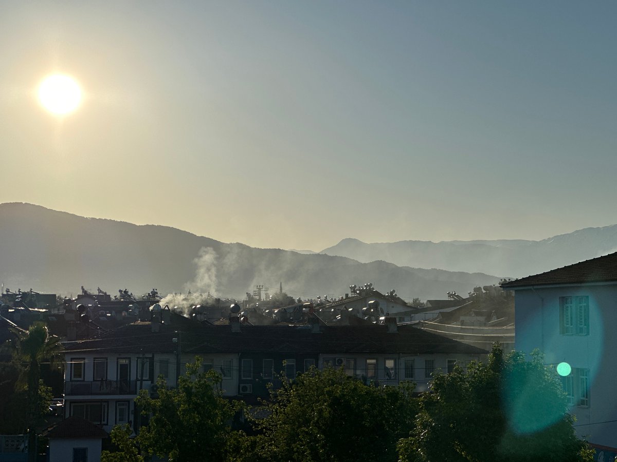 Woman takes morning selfies in sunny Fethiye, Turkey