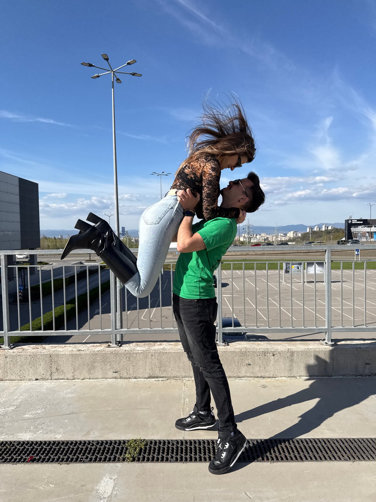 Couple embraces in sunny Sofia amid spring gardens