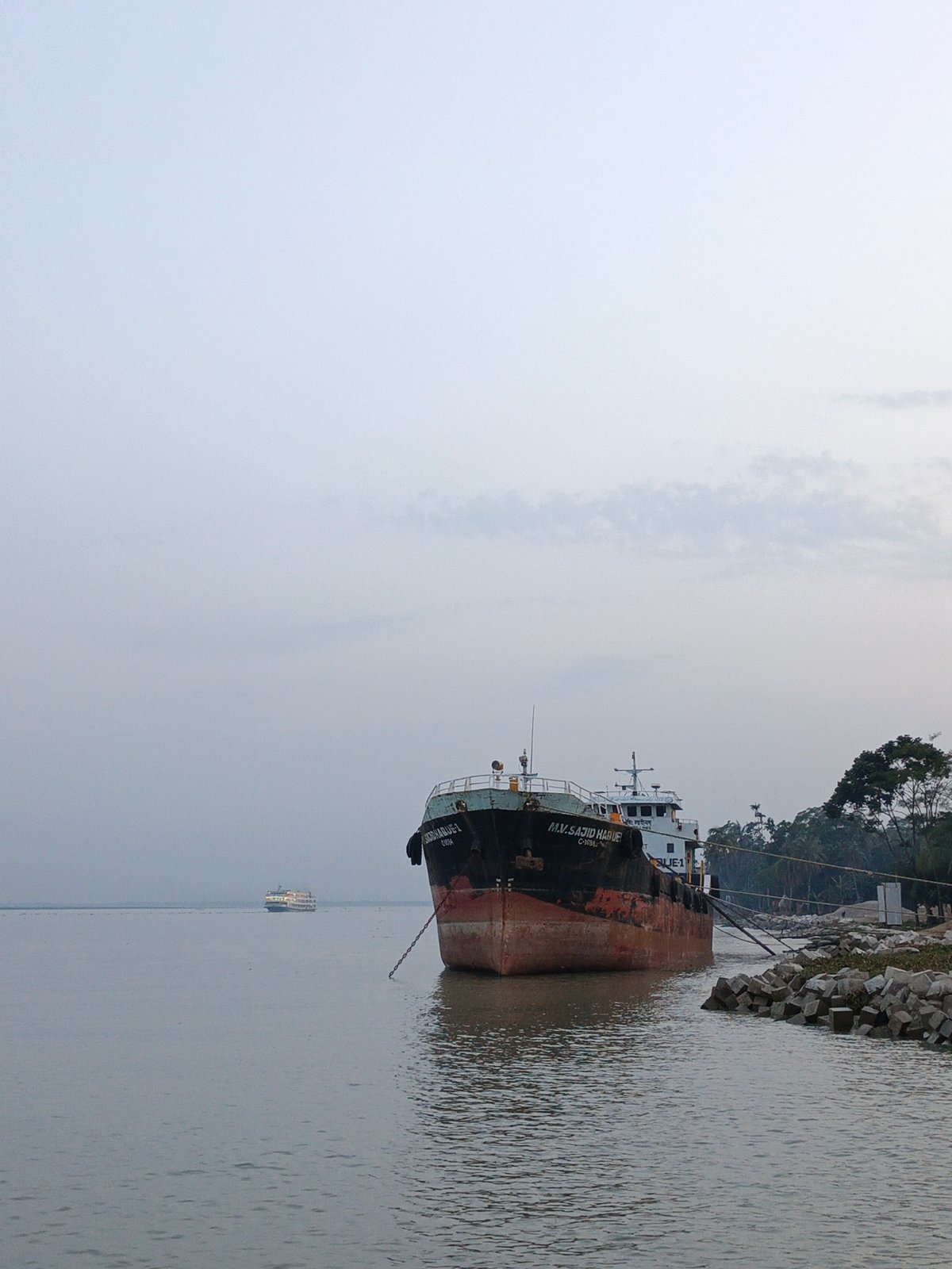 Cargo ship operations, street work documented at unidentified port city
