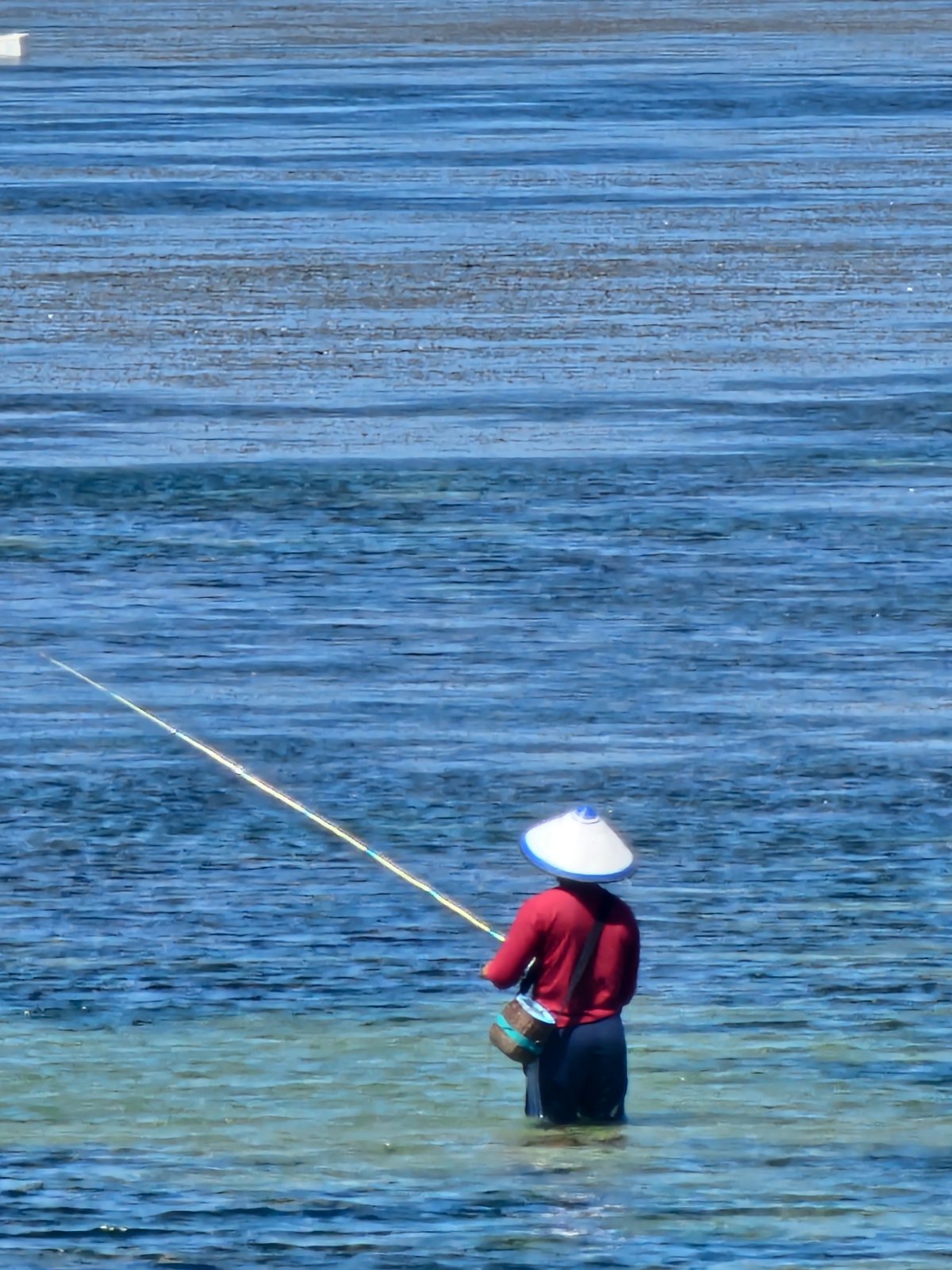 Sanur beach morning: boats, fishing, and tropical resort life