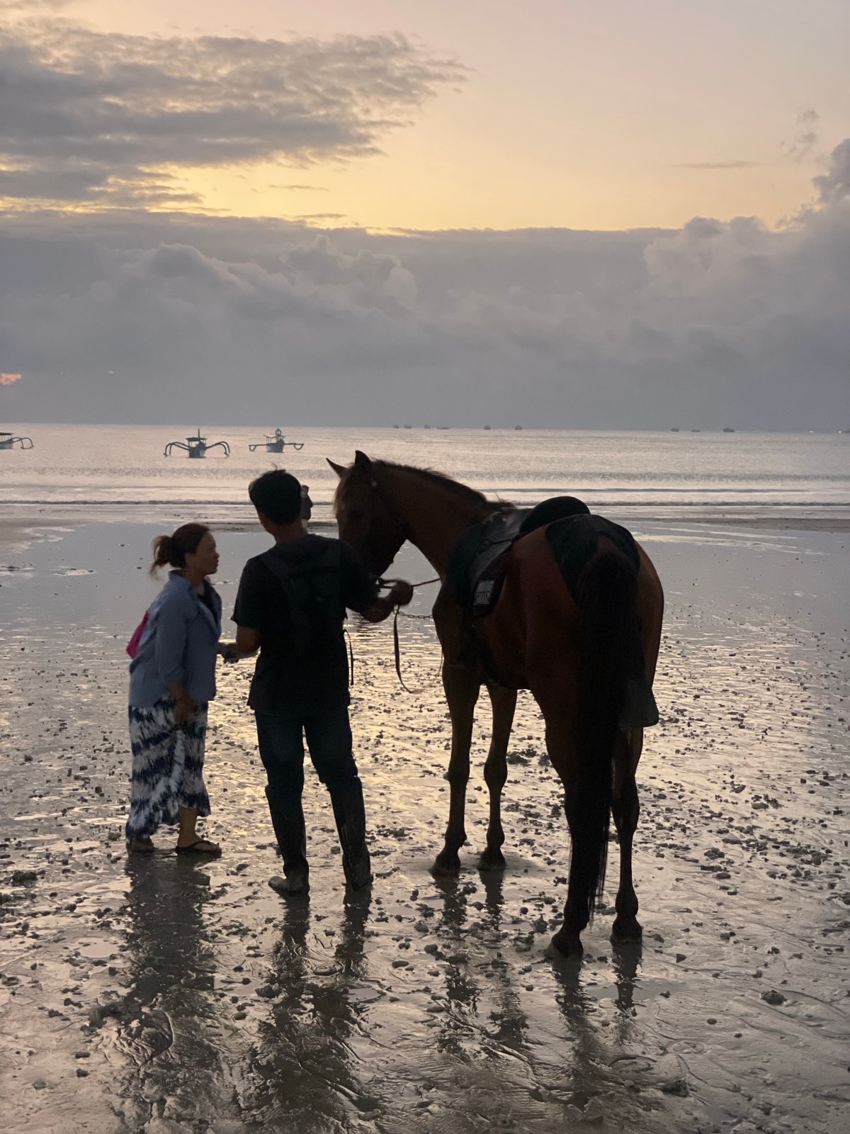 Horses, candlelit tables, and a beach at dusk