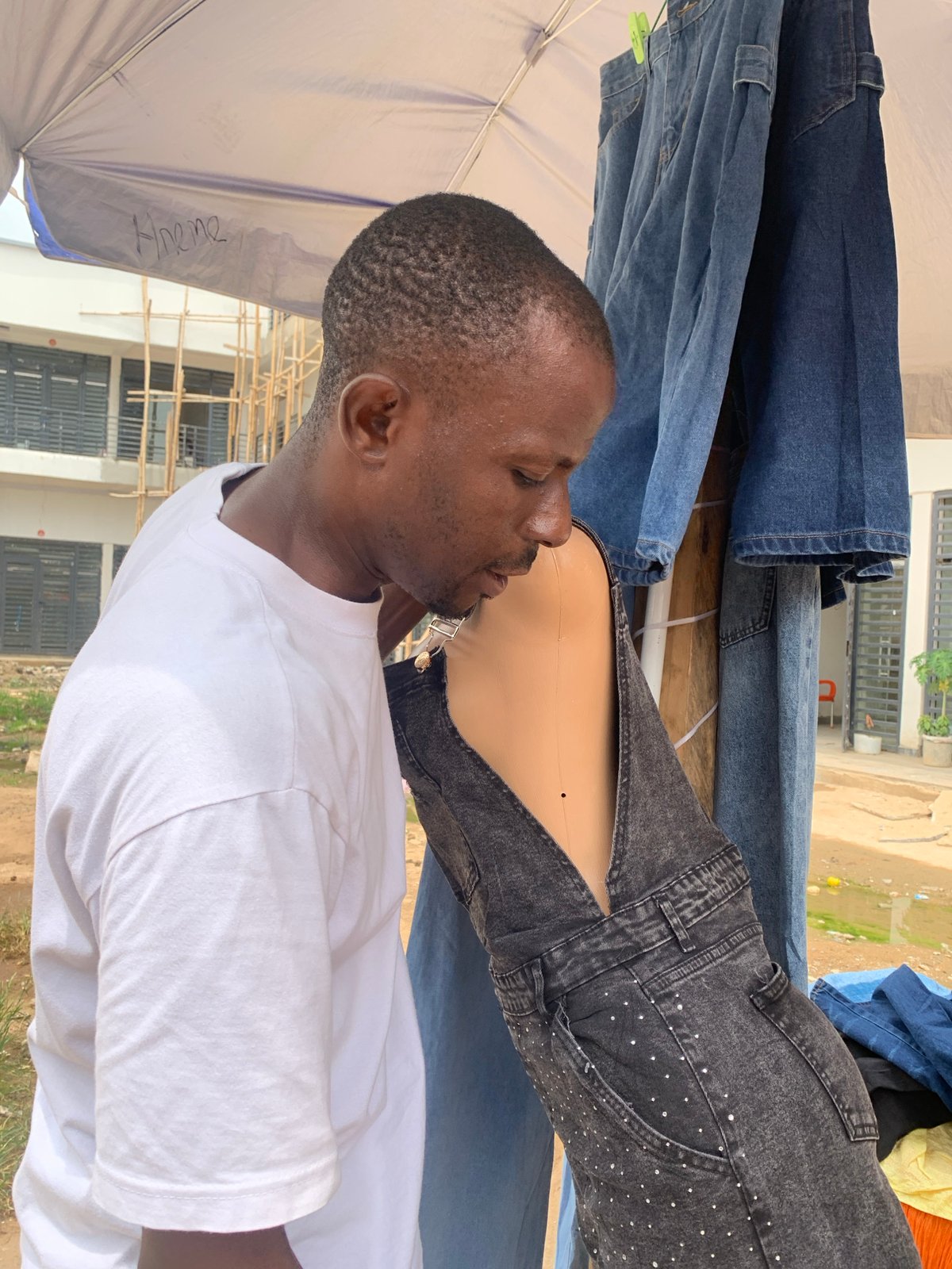 Morning market activity across an Abuja street bazaar