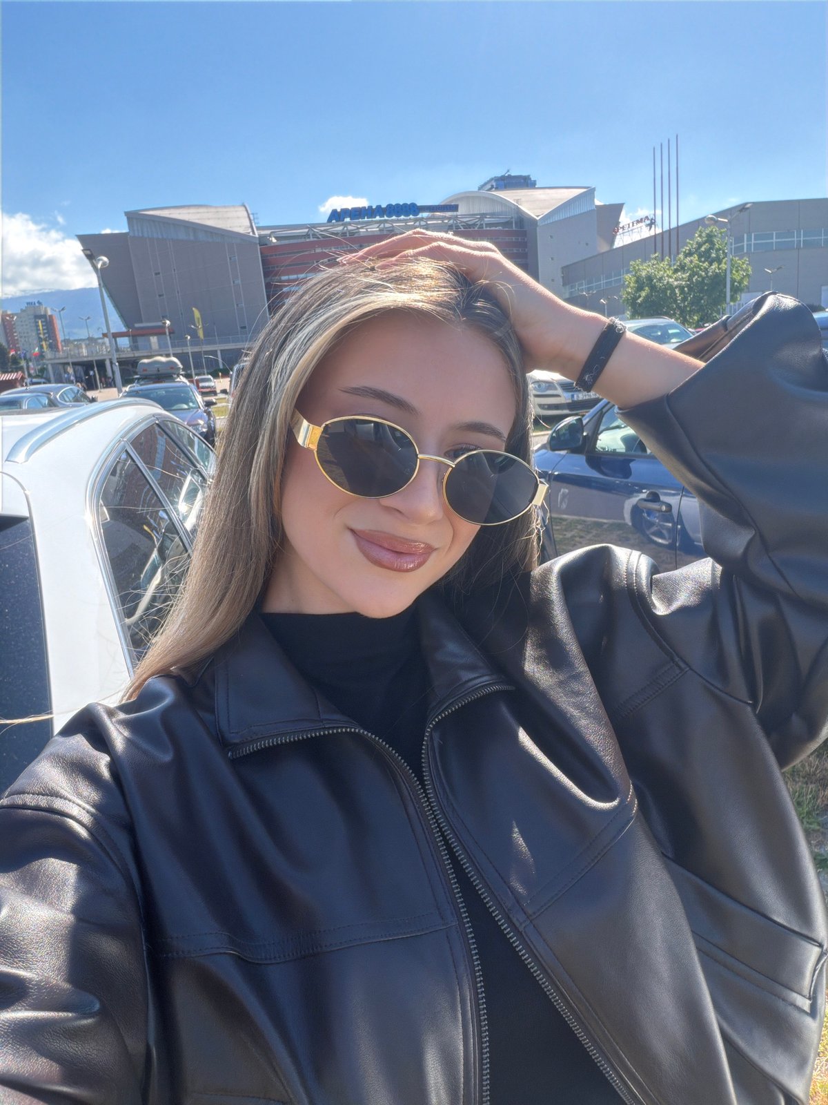 Woman takes selfies outside Arena Armeec in Sofia