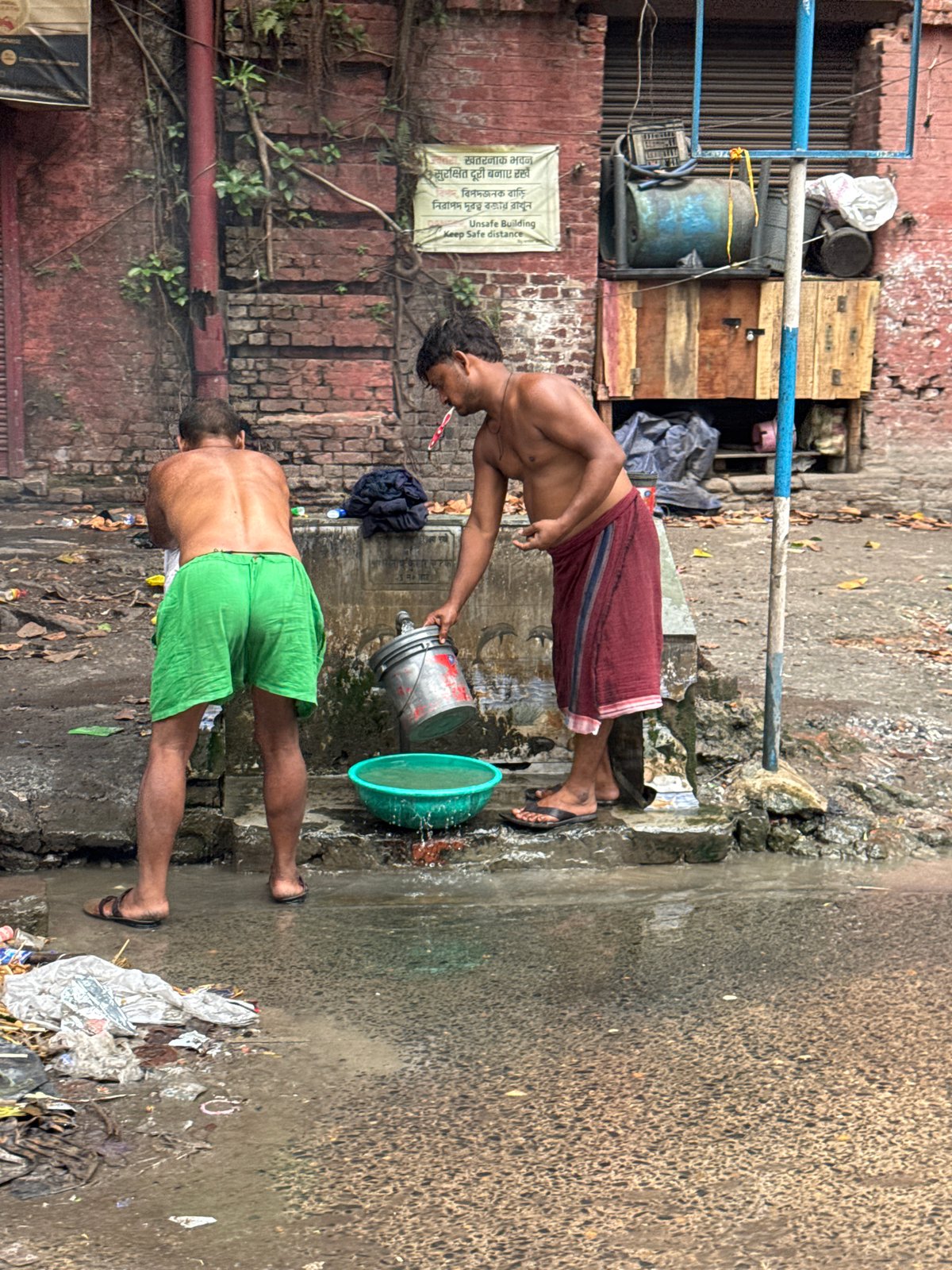 Early morning street life documented across Kolkata neighborhood