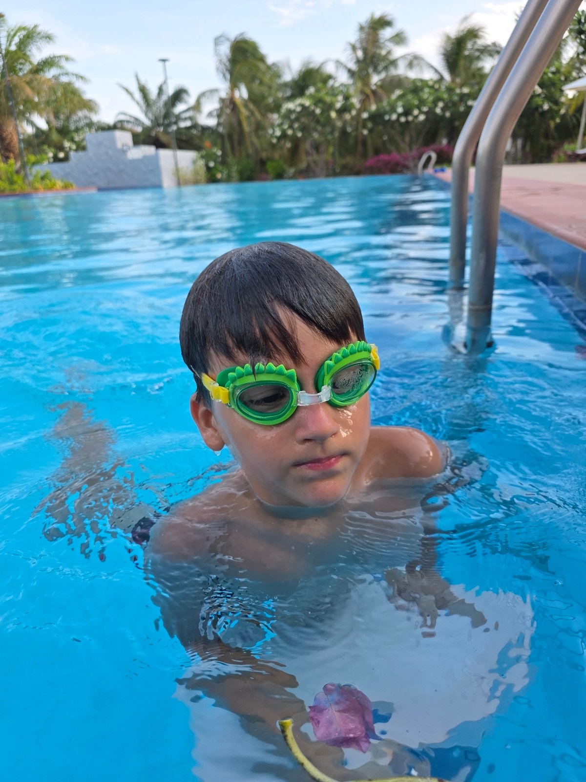 Children swimming at Phu Thuy Ward pool Vietnam
