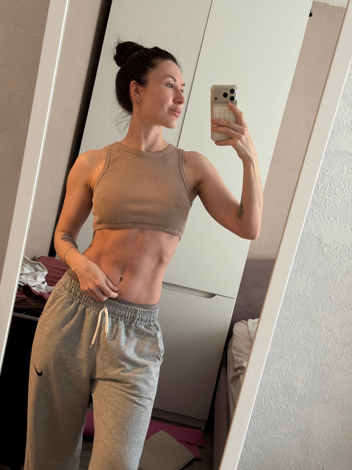 Woman Takes Mirror Selfie in Early Morning Perm