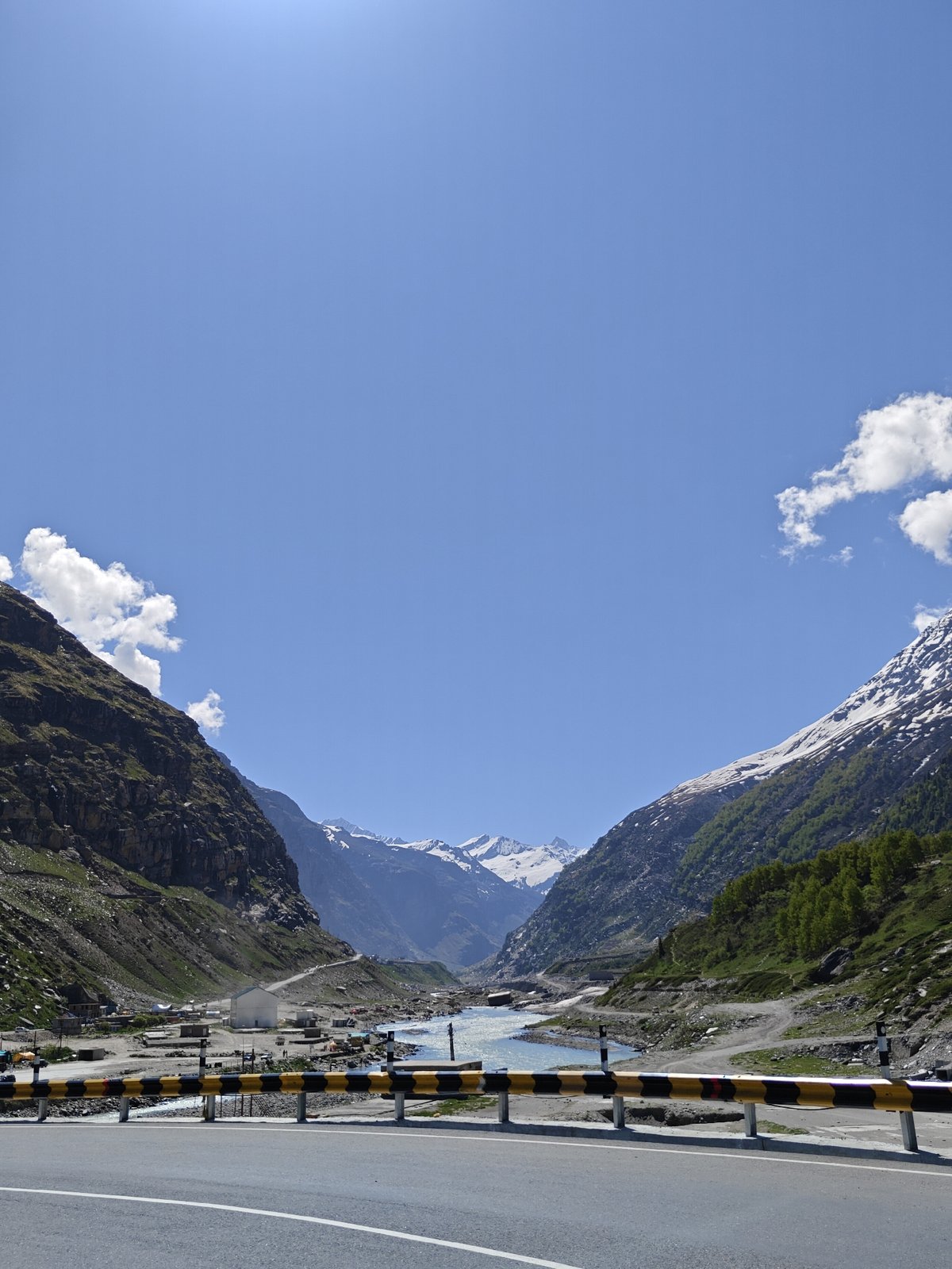 Mountain highway and river documented in northern India valley