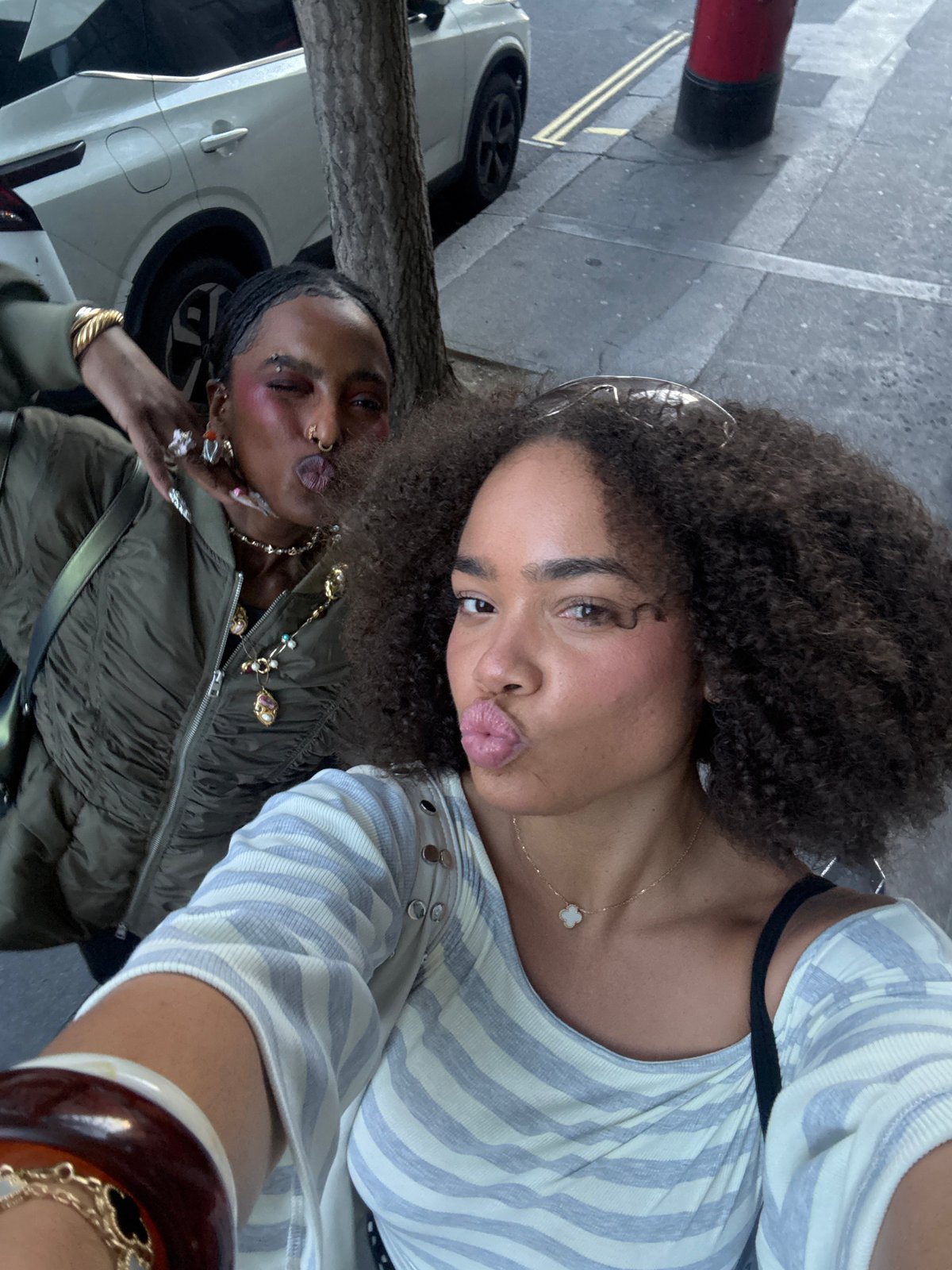 Selfie moment captured near modern London building Wednesday evening