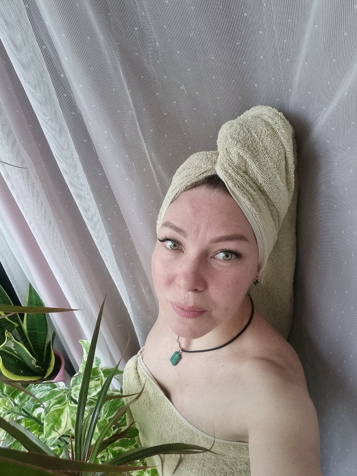 Woman photographs herself in towels during morning session