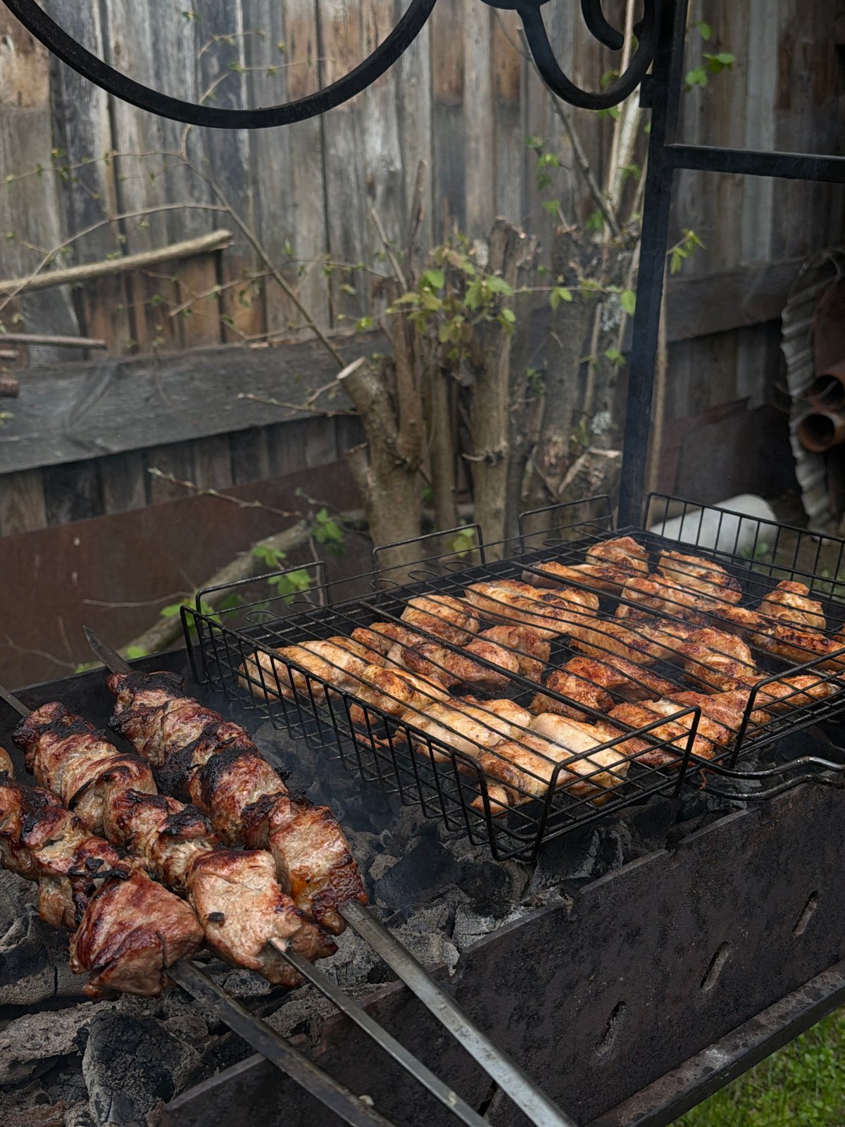 Spring outdoor gathering features barbecue, gardening, and casual dining
